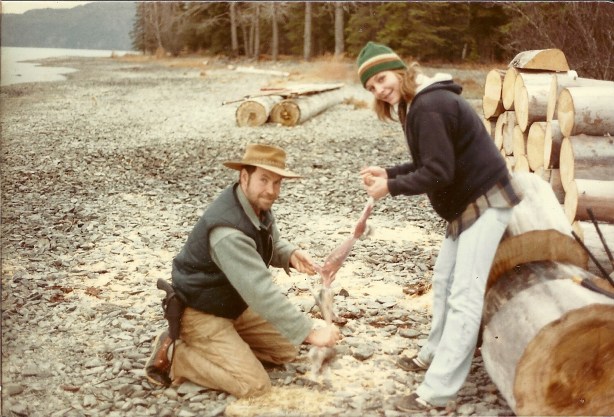 My sister came to visit our fourth year on the island. She is seen here with Sam as they skin a rabbit that Sam just shot for our supper.
