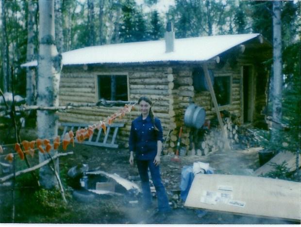 The salmon have been soaking in the brine and are now drying. They will soon go into the smoker that Sam made from a barrel pictured in the foreground