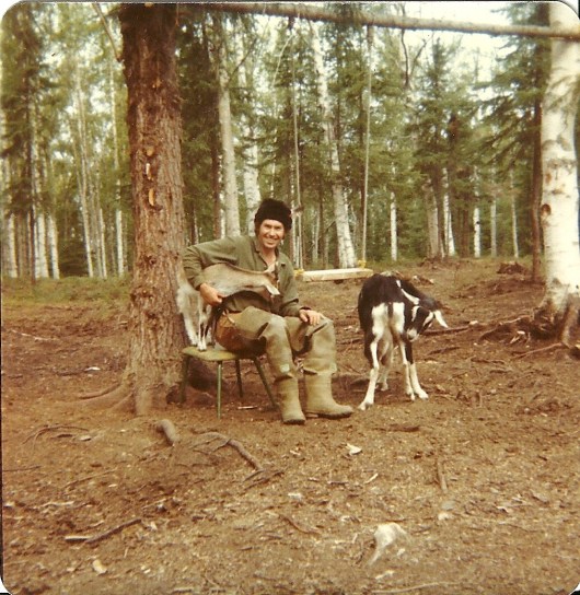 Heidi is trying to get Sam's tobacco out of his shirt pocket!
