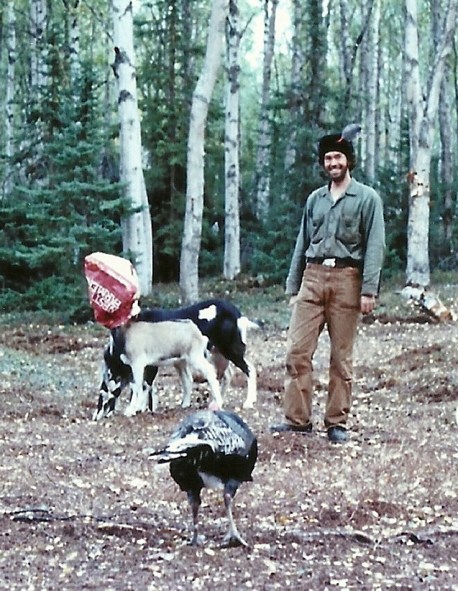 Our little homestead slowly included new members. Sam is pictured here with my milk goat, Esther, and our two kid goats, Heidi and Billie . . . oh, and let's not forget, our turkey, General Lee.