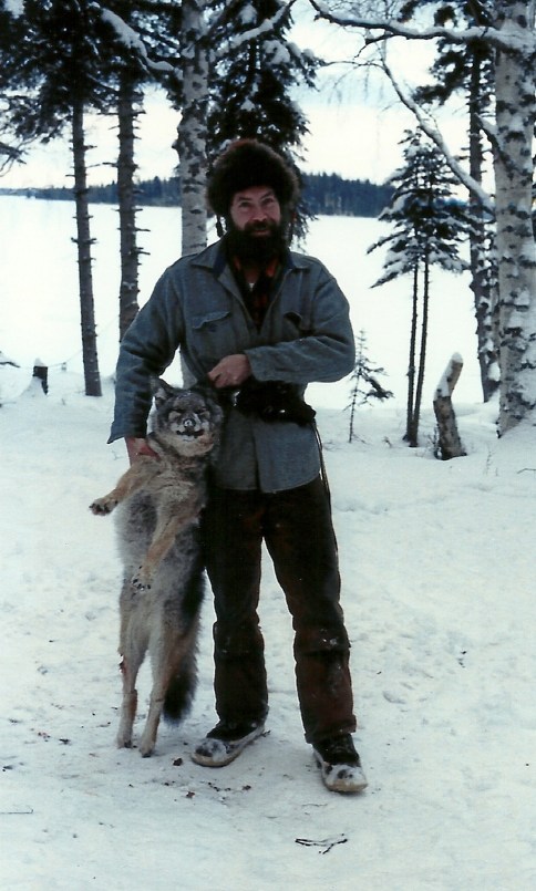 Sam with a coyote he caught. Along with coyote, Sam trapped, mink, otter, beaver and more.