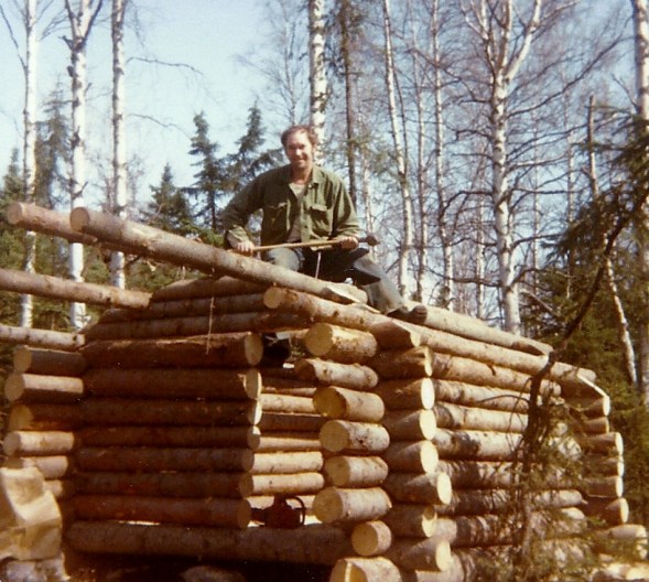 Sam building a log chicken coop for our chickens! Good job, Sam!